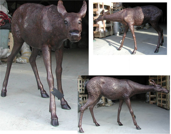Life size bronze doe deer with noses extending curiously